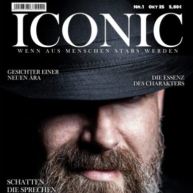 Mann mit Hut auf dem Cover des Magazins "ICONIC", mit dem Titel in Großbuchstaben.